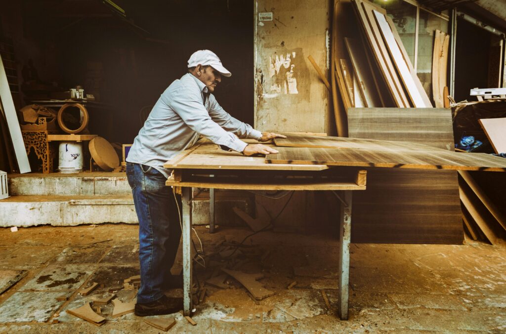Man building out of wood | Amish storage sheds | Rooster's Amish Sheds WV