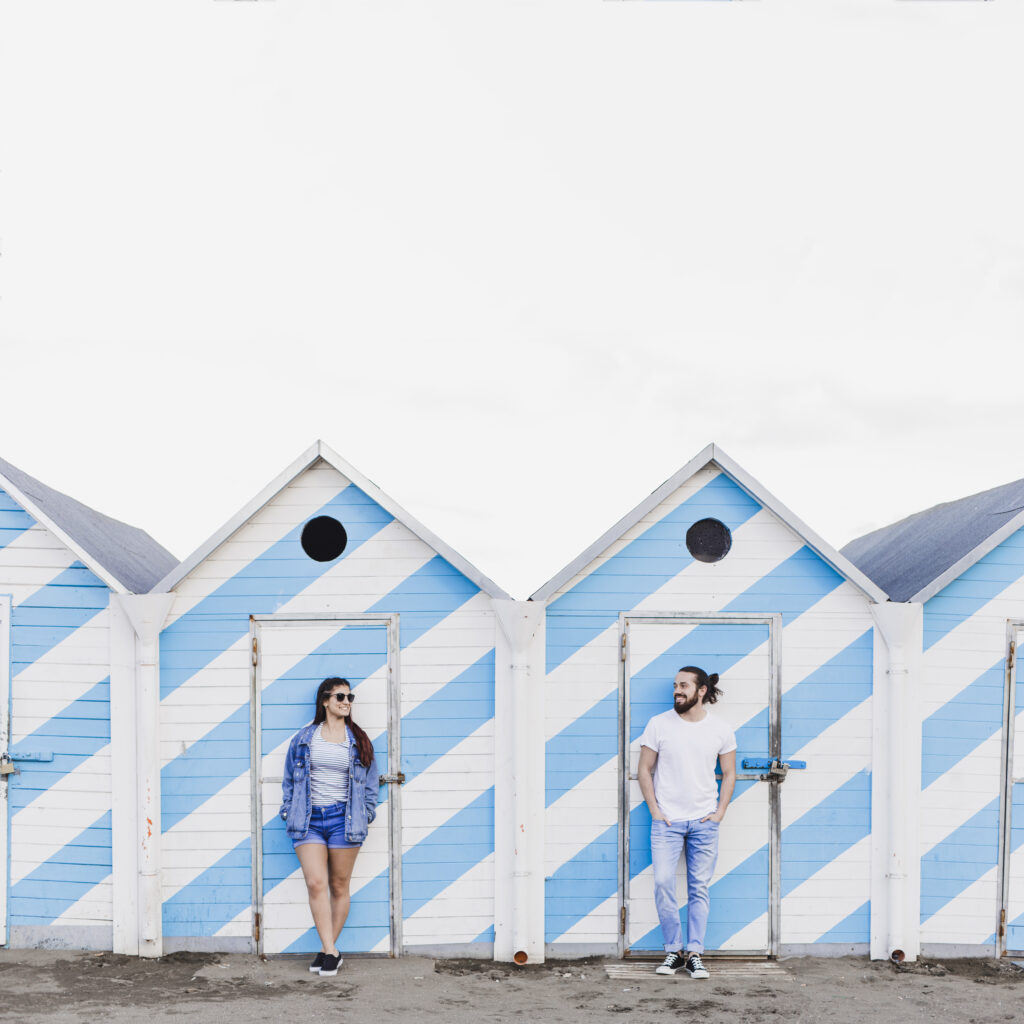 Couple standing in front of Amish build sheds | Shed Buying Guide | Rooster's Amish Sheds, WV