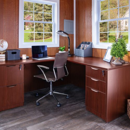 Home office with a corner desk, chair, and computer | Uses for Storage Sheds | Roosters Amish Sheds Bunker Hill, WV