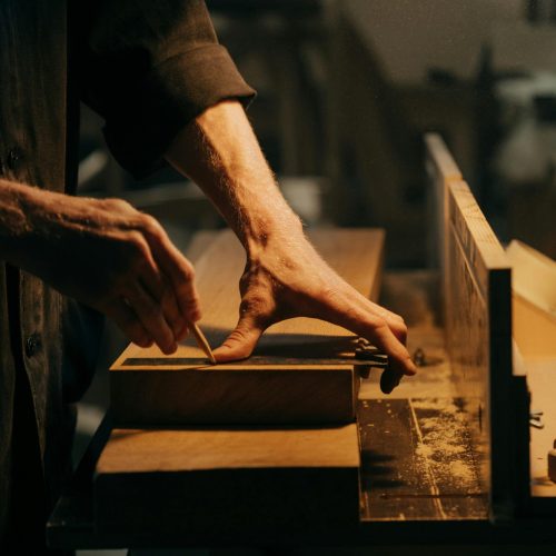 Man woodworking | Storage Sheds | Rooster's Amish Sheds, WV