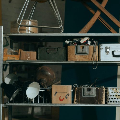 shelving unit with various boxes and knick-knacks | Outdoor Storage Shed Organization