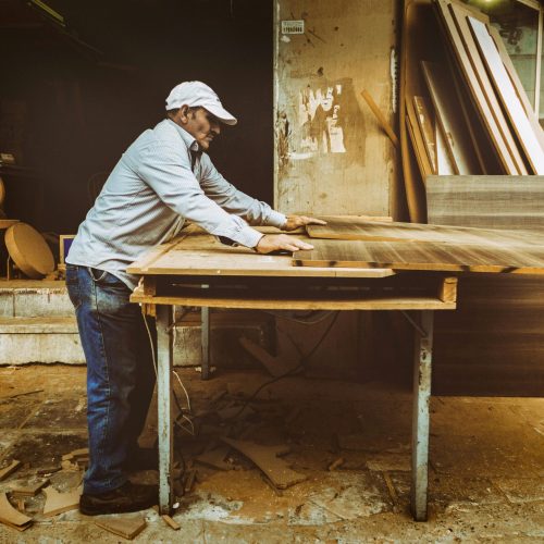 Man building out of wood | Amish storage sheds | Rooster's Amish Sheds WV